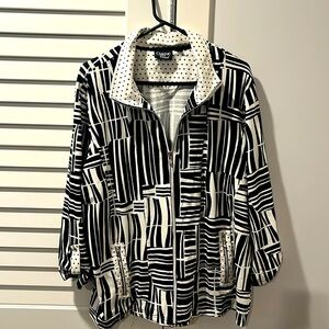 Black and white zipper front jacket with front pockets.